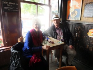 Charlie and Sarah at a brown cafe.