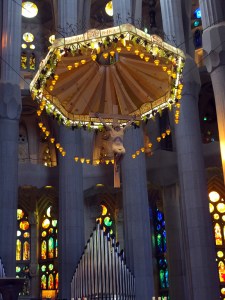 The majesty is tempered by touches of whimsy, such as the circus-like presentation of the crucified Christ suspended over the altar.