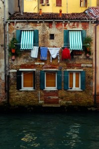 Our windows the three at water level. The center window used to be a door. Many Venetian structures have canal-side doors.