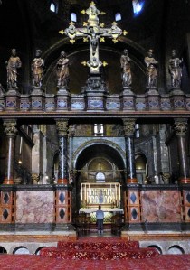 The tiny central figure praying at the central altar of St. Mark’s shows the scale of this massive basilica.