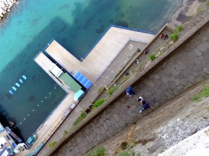 This view looks straight down from a walkway hundreds of feet above the shoreline.