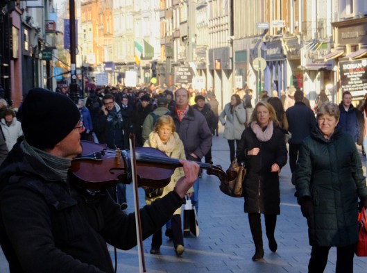 Modern life thrives in old and new Dublin. Grafton Street is a famous shopping destination.