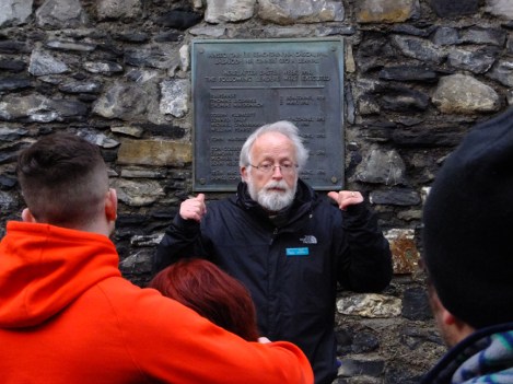 The tour then takes visitors to the yard where the executions following the Rising were carried out. The plaque behind the tour guide lists the names of the 15 patriots who were executed here in May 1916.