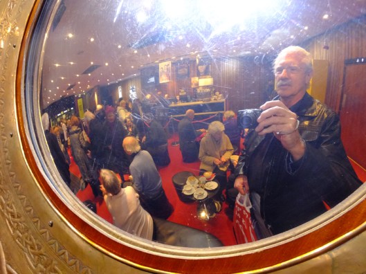 This is a selfie-portrait of me in the Abbey's lobby, seen through the fisheye lens of an ornate mirror.