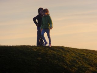 These children almost appear to be dancing to an ancient Celtic tune atop the Mound of the Hostages. 